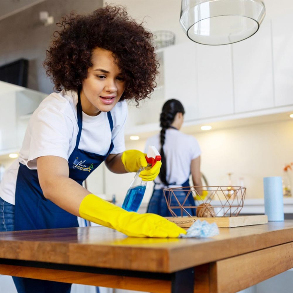 Expert cleaner performing meticulous deep cleaning in a San Diego County kitchen, ensuring every corner is spotless
