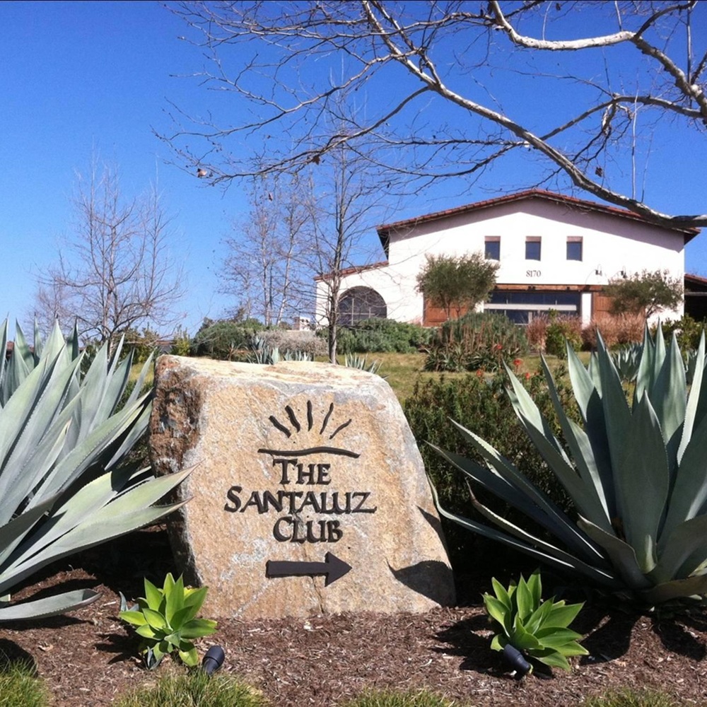 Cleaner detailing counters, fixtures, and floors inside upscale Santa Luz home