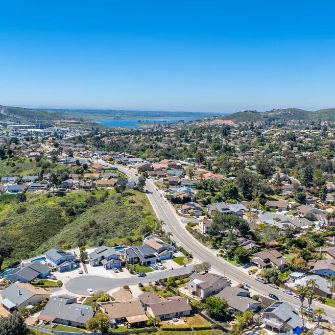 Cleaner finishing bathroom and kitchen cleaning before family returns to Spring Valley home